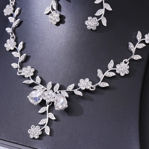 Elegant silver bridal jewelry set with sparkling rhinestones floral necklace and earrings