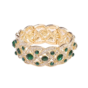 Elastic gold bridal bracelet with emerald green stones and sparkling white rhinestones