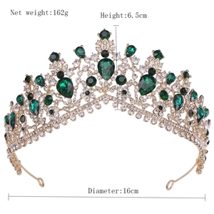 Baroque gold crown with emerald gems and rhinestones showing 6.5cm height and 16cm diameter