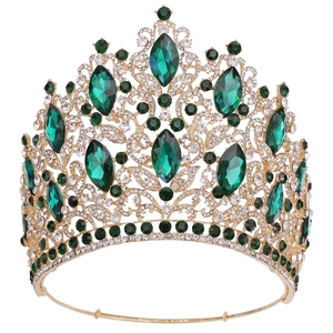 Luxurious gold leaf bridal crown with emerald green crystals and white rhinestones