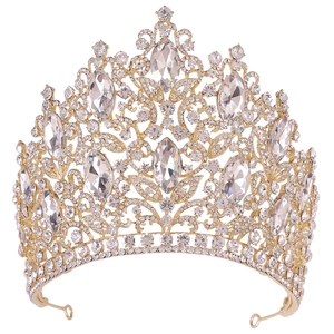 Detailed view of the luxurious gold bridal crown with crystals and leaf motifs
