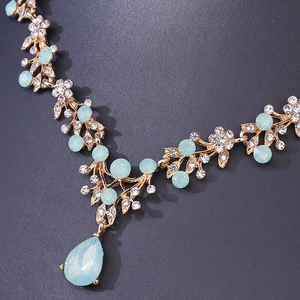 Bridal jewelry set with gold leaf necklace, mint green teardrop stones and crystals