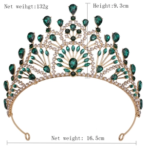 Detailed view of vintage gold bridal tiara with green gems and size measurements