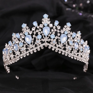 Detail shot of luxury silver crown with blue opal teardrop stones and white rhinestones