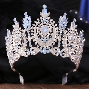 Macro view of Baroque bridal crown with silver base, blue opals, and sparkling rhinestones