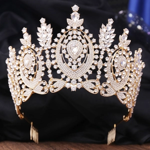 Macro detail of Baroque bridal crown with gold metal base and sparkling clear rhinestones