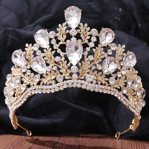 Detailed macro view of baroque gold bridal crown with crystal leaf patterns