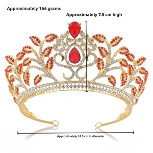 Detailed view of luxury baroque leaf crown with red rhinestones and golden base details