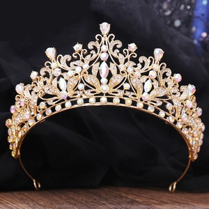 Detailed close-up of golden bridal crown with sparkling AB rhinestones and floral design