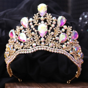 Macro shot of Baroque bridal tiara with gold base and rainbow crystal teardrops