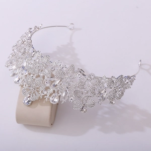 Detailed view of silver leaf bridal crown with sparkling rhinestones and pear-shaped drops