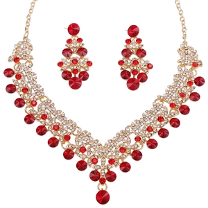 Luxurious gold bridal jewelry set with red rhinestones including necklace and earrings