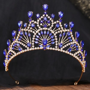 Detailed view of Baroque gold bridal crown featuring dark blue crystals and rhinestones