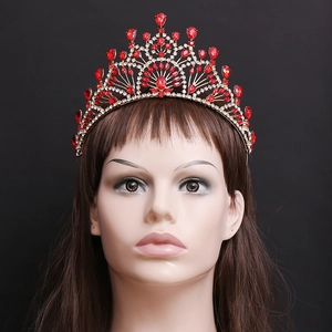 Elegant gold baroque crown for brides featuring ornate red rhinestones and crystal teardrops