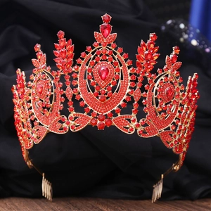 Macro shot of the luxurious gold tiara featuring ruby red rhinestones and intricate details