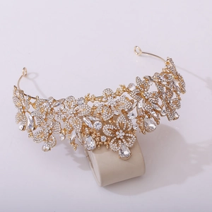 Detailed view of the gold leaf tiara featuring intricate crystals and rhinestones