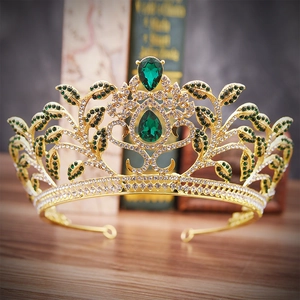 Baroque gold bridal crown with green teardrop gemstones and crystal leaf details