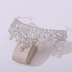 Detail of luxury bridal tiara with silver alloy frame and teardrop crystal pendants