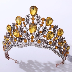 Detailed close-up of Baroque bridal crown with yellow crystals and vintage bronze alloy
