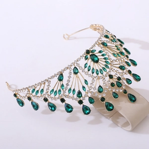Vintage gold bridal crown with emerald green teardrop gemstones and white rhinestones