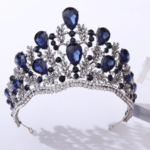 Detail of baroque bridal tiara with silver leaf patterns and pear-cut blue crystals