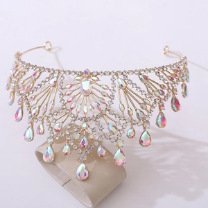 Macro detail of golden bridal crown featuring iridescent AB rhinestones and teardrop crystals