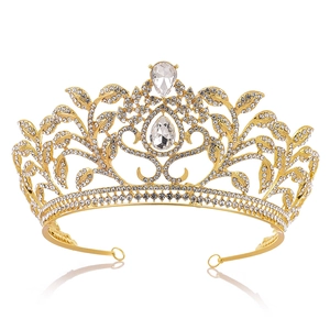 Detail of luxury gold bridal crown with crystal leaf vine patterns and teardrop stones