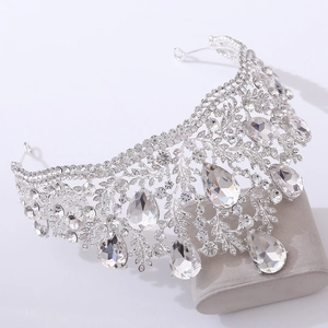 Close-up of silver baroque bridal crown with floral crystals and teardrop pendants