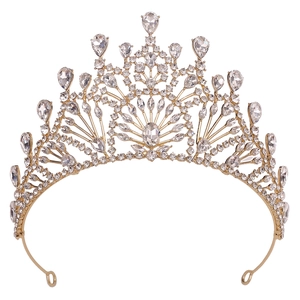 Macro detail of a baroque gold bridal crown with radiant rhinestones and crystal accents
