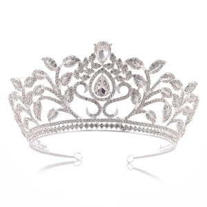 Detailed macro view of silver leaf crown featuring pear-cut crystals and intricate rhine stones
