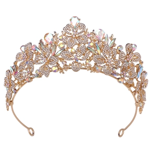 Close-up of gold bridal crown with AB rhinestones and baroque leaf pattern details
