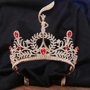 Exquisite gold bridal tiara with red teardrop rhinestones and centered goddess figure