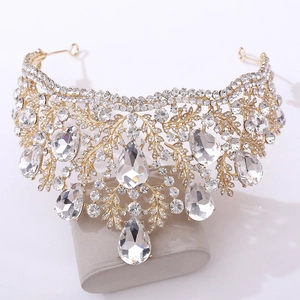 Detailed view of luxury baroque bridal crown with crystals on gold-plated metal base