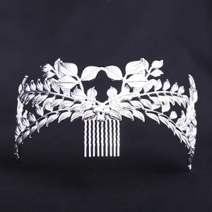 Detailed macro view of silver leaf crown hair comb for bridal wedding accessories