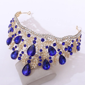 Baroque gold bridal crown with deep blue crystals and intricate diamond leaf design
