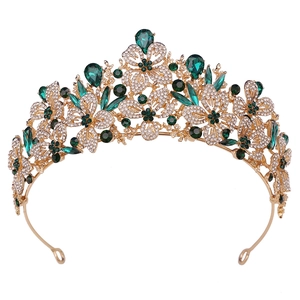Golden Baroque bridal tiara crown featuring emerald green gems and sparkling rhinestones