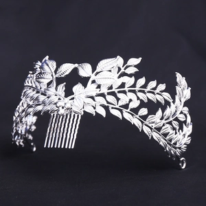 Baroque style silver leaf bridal hair comb with vintage vein texture on black background