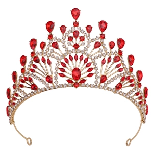 Detailed front view of golden baroque crown featuring red gemstones and crystal rhinestones