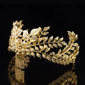Elegant Baroque gold leaf bridal hair comb with laurel leaf design on reflective black background
