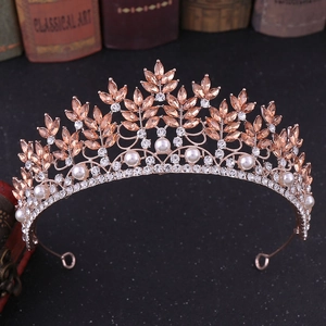 Detail view of champagne crystals and pearls on a rose gold bridal crown tiara