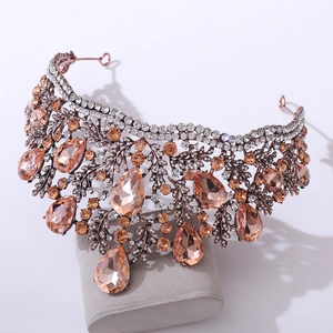 Macro detail of Baroque bridal crown with champagne pear-cut crystals and rose gold filigree