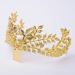 Detail of golden laurel leaf hair comb with textured finish for bridal hair accessories