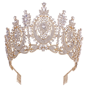 Detailed view of Baroque gold crown with clear crystals and secure hair combs