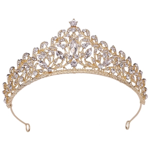 Close-up of golden bridal crown featuring leaf textures and sparkling clear crystals