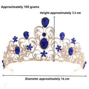 Detail view of gold bridal crown with blue gems and white crystals, 7.3cm high and 16cm wide