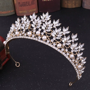 Close-up of Baroque gold crown with marquise rhinestones and white pearls for brides