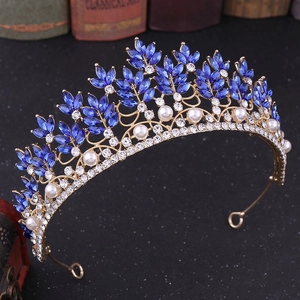 Detailed macro view of baroque bridal crown with blue leaf crystals and white pearls