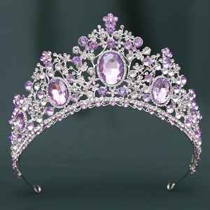 Close-up of luxury bridal crown with purple crystal rhinestones on silver alloy