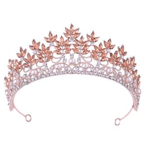Baroque bridal crown with rose gold crystal leaves, pearls and rhinestones on white background