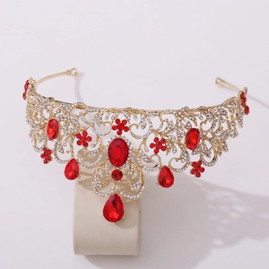 Detailed macro view of baroque bridal tiara with red crystals and white rhinestones